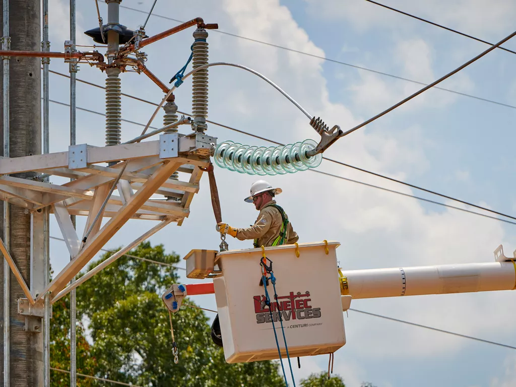 A Linetec employee working on power lines.