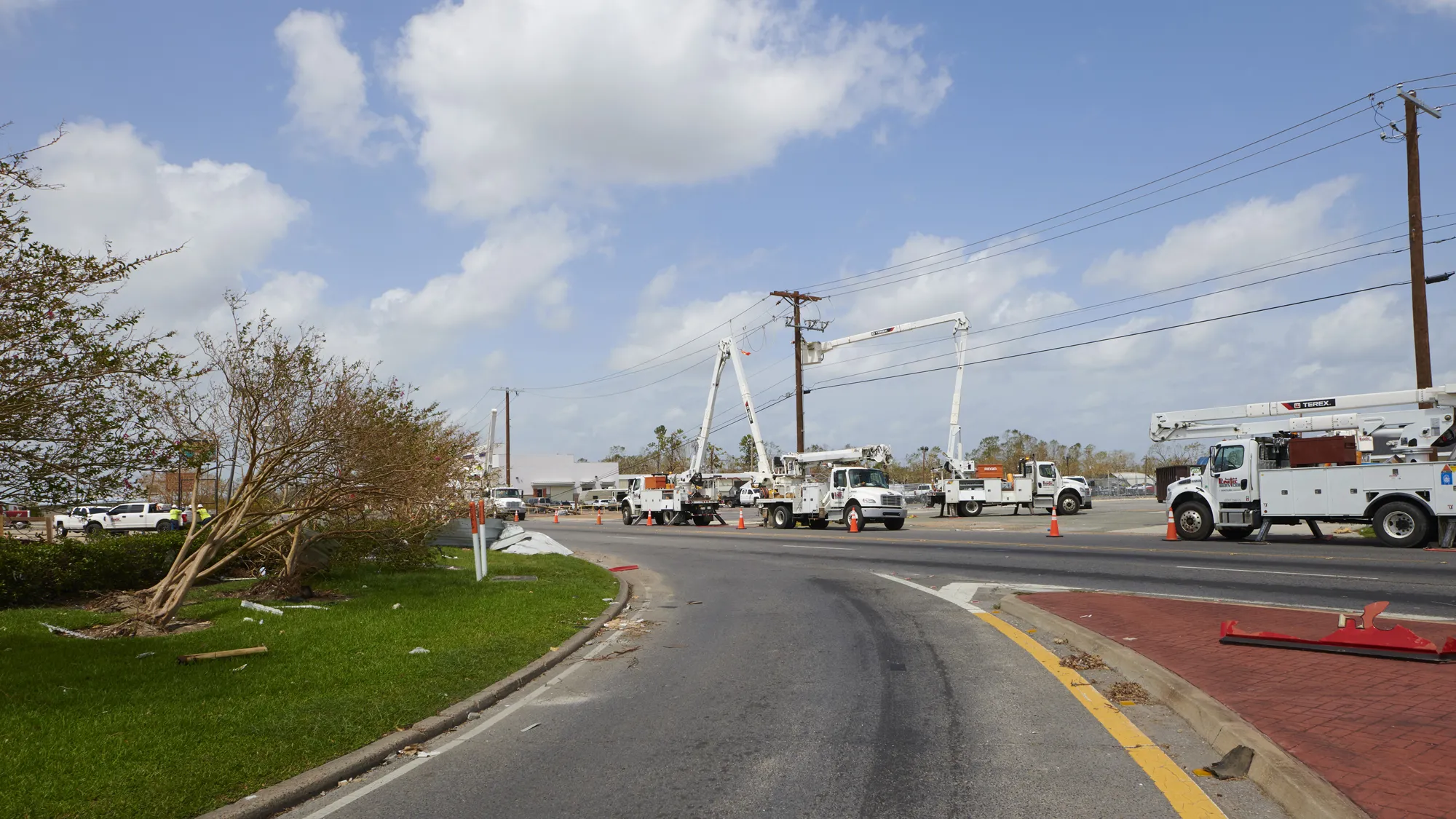 Linetec trucks fix power lines after a storm.