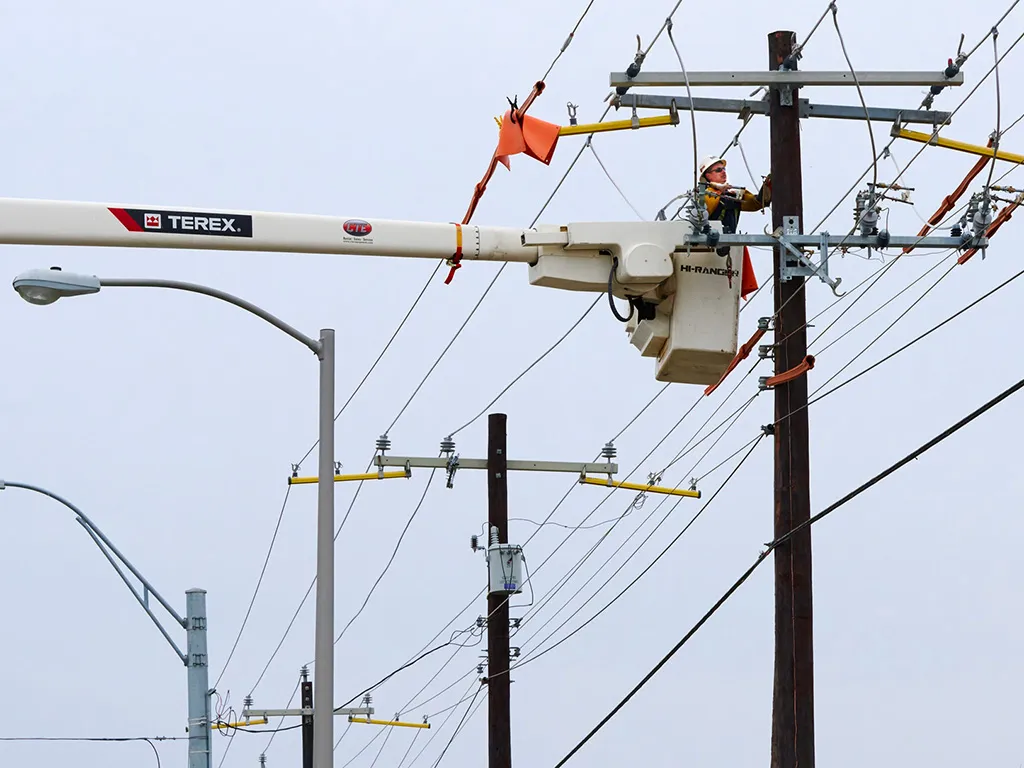 A Linetec Employee works on power lines in Harlingen, Texas